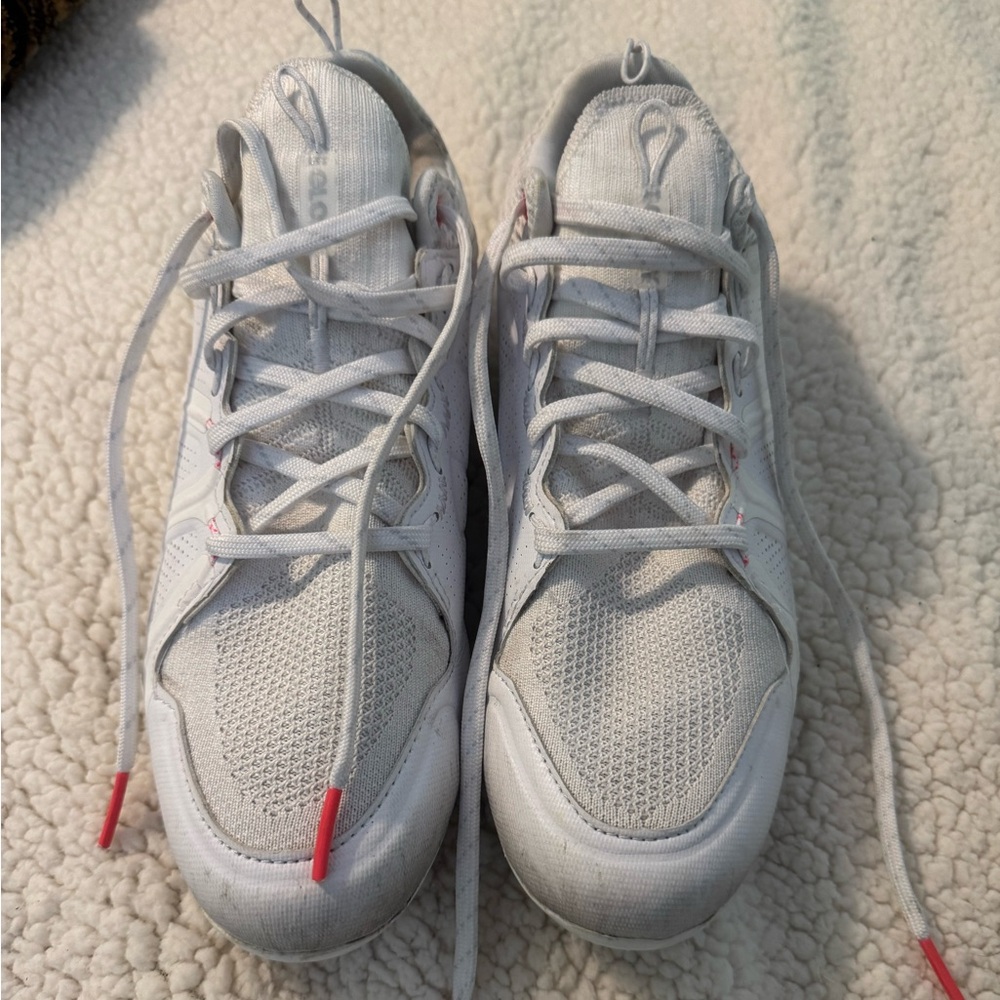 Under Armour women’s size 8.5 white and neon pink cleats